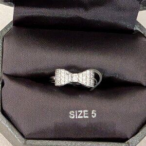 Dillard's dainty silver and faux diamond bow ring